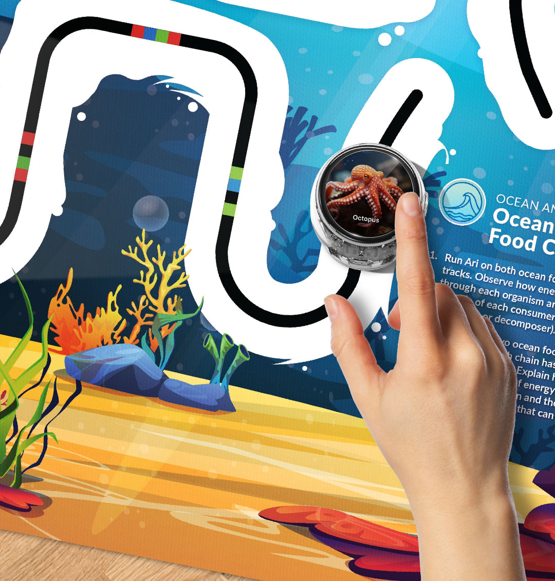Student using a magnifying glass to investigate planetary routes and coding pathways on the Ari Adventure Mat: Space Navigation STEM activity mat.