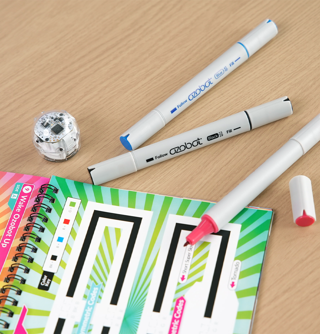 Ozo at Home activity book and Color Code markers, and Evo coding robot 