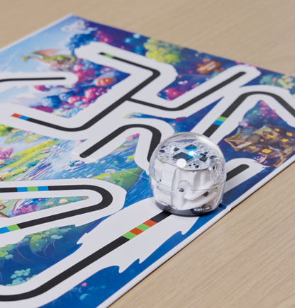 Ozobot robot following a Color Code path on the Ozo at Home activity mat for hands-on coding and STEM learning