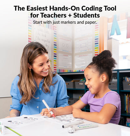 Teacher helping a student code an Ozobot Evo robot, a whole-class STEM coding tool for elementary schools