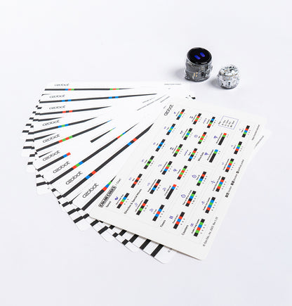 Sheets of Ozobot Color Code Stickers spread out, with Ari STEM robots ready for coding play